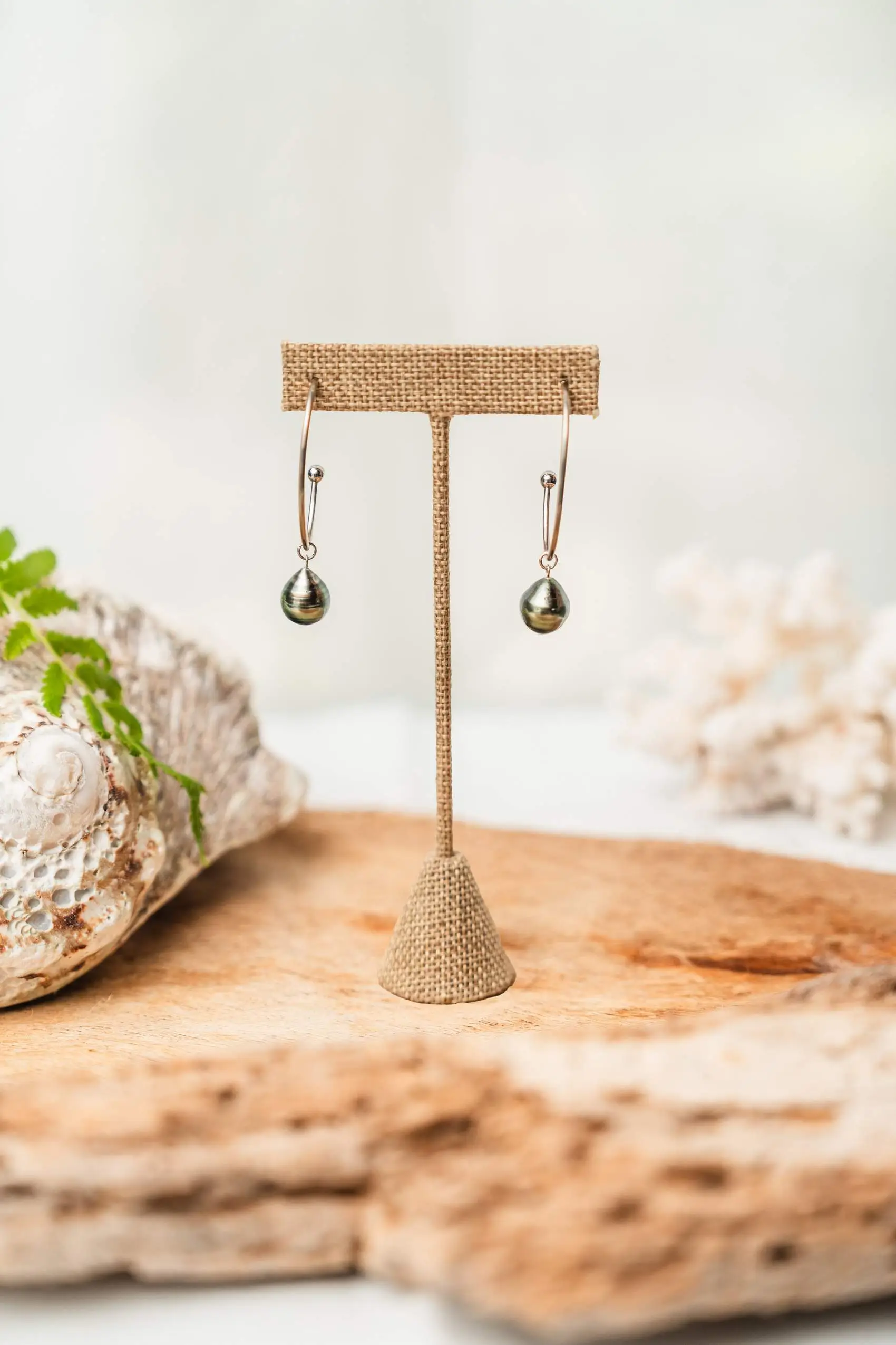 Silver earrings with oval semi-open setting and Tahitian pearls