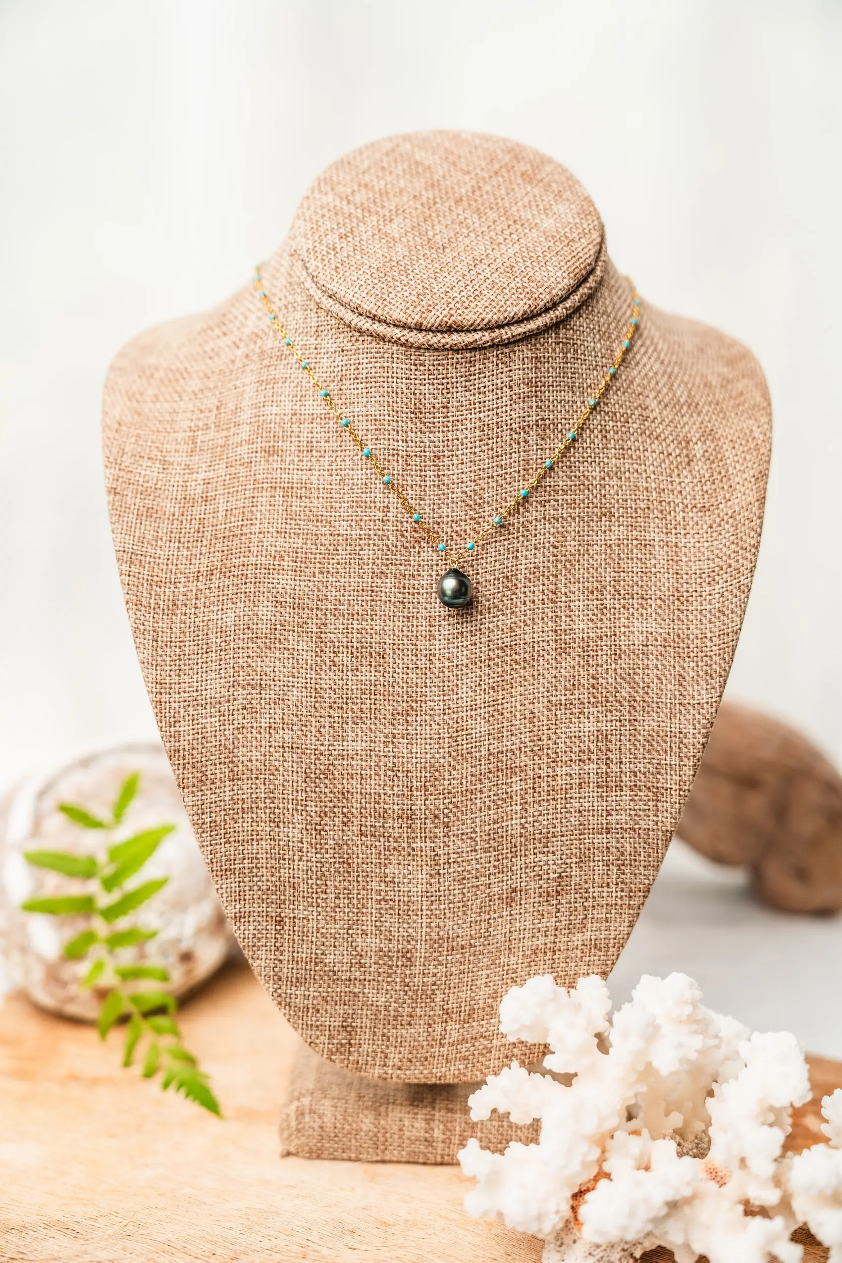 Simple Tahitian pearl necklace with gold chain and turquoise balls
