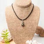 Collier Tiki argent avec perle de Tahiti et cuir tressé